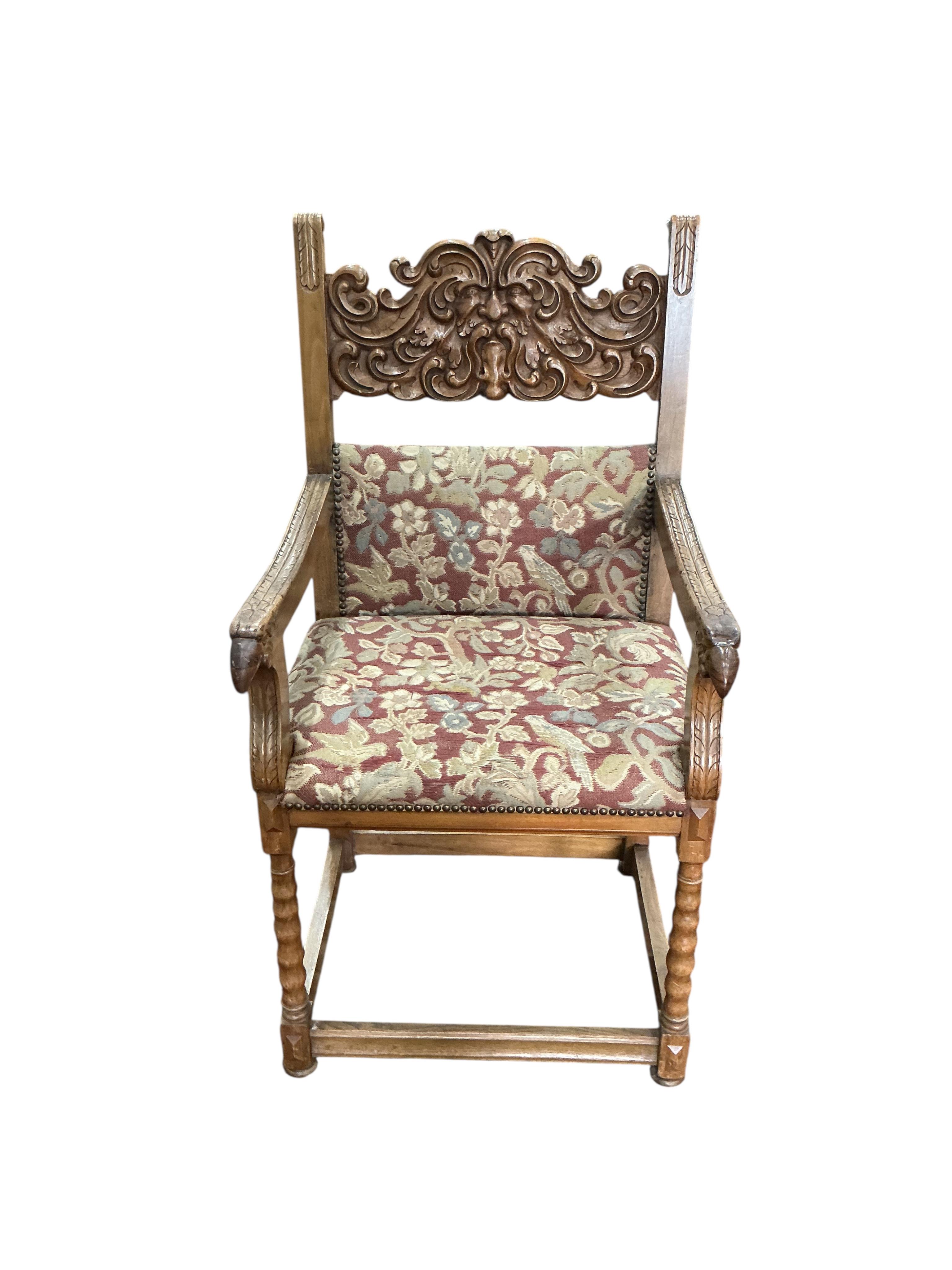 An 18th century style carved walnut elbow chair, width 56cm, depth 54cm, height 111cm